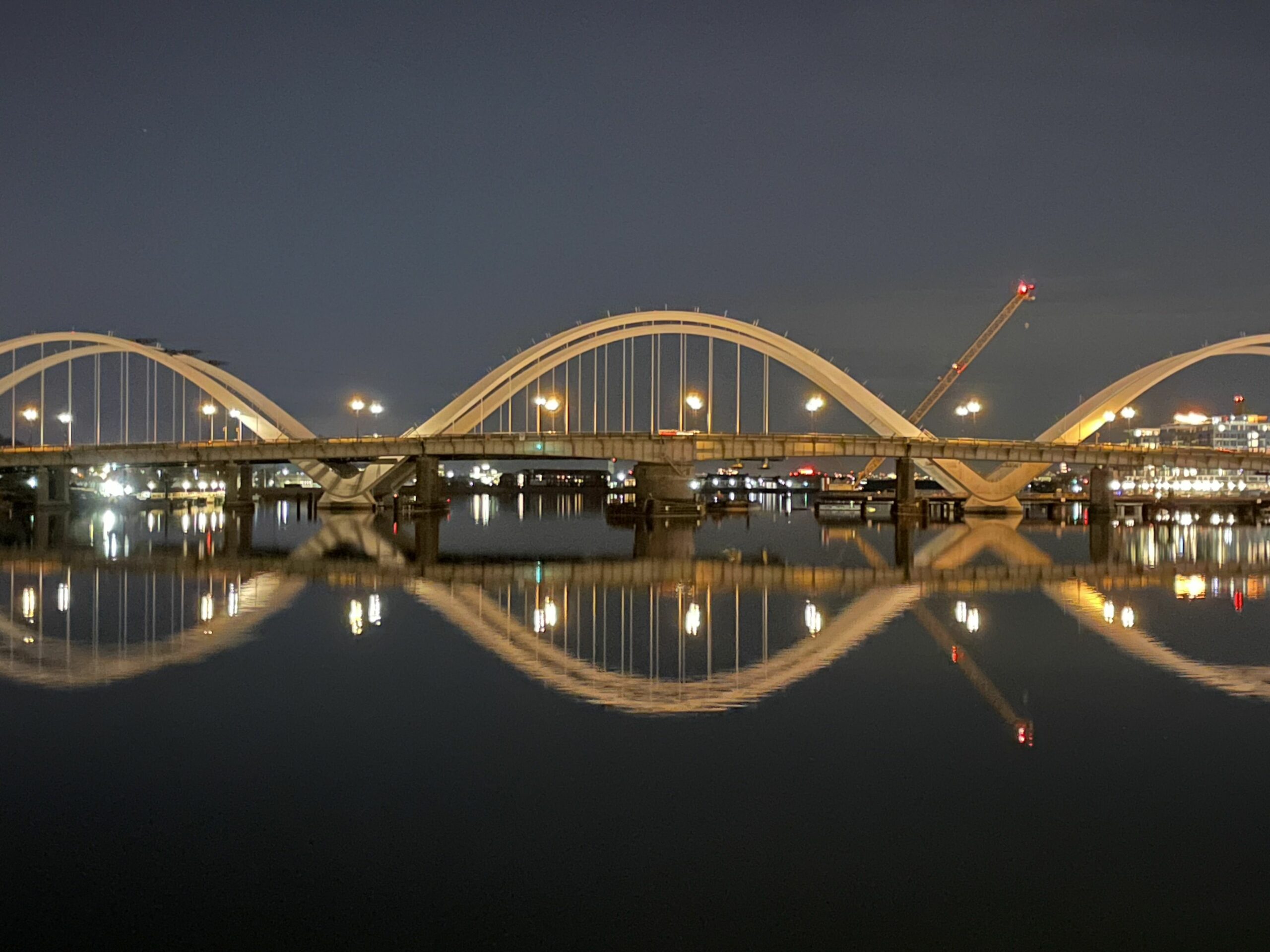 Frederick Douglass Memorial Bridge reflected in the Anacostia River at night
